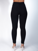Step into contemporary fashion with our Black Wide Leg Cargo Pants. Designed for the style-savvy, these loose-fitting trousers feature deep side pockets with secure strap closures and a stylish button waist. Perfectly balancing function and flair, they're the ideal addition to your modern wardrobe. Black High Rise Distressed Skinny Jeans Denim, Black Denim, Zade Fashion