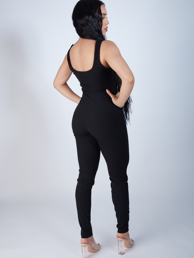 Black rib knit fabric jumpsuit with a sophisticated scoop neck design, Sleeveless scoop neck jumpsuit in chic black, crafted from rib knit material, zade fashio