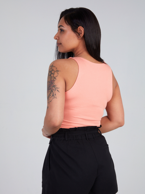 Zade Fashion sleeveless peach bodysuit featuring high mock neckline and stretchy comfortable fit. Perfect for layering or wearing alone.