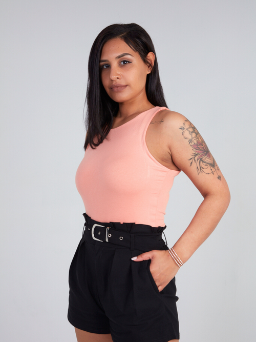 Zade Fashion peach high mock neck bodysuit with sleeveless design and form-fitting silhouette. Soft viscose blend with snap closure bottom.