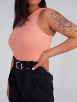 Zade Fashion soft coral high neck bodysuit with sleeveless cut and snap closure bottom. Premium viscose-spandex blend for ultimate comfort.