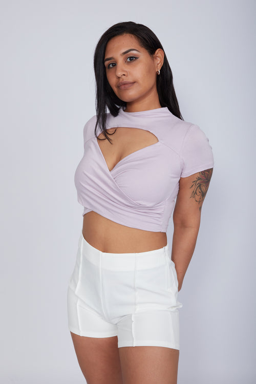 Zade Fashion pink short sleeve crop top with sophisticated chest cutout and wrap design. Form-fitting polyester-spandex blend for ultimate comfort and style.