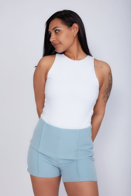 Zade Fashion premium high-waisted pintuck shorts in light blue. Featuring elegant vertical stitching, tailored fit, and sophisticated design perfect for summer events and resort wear.